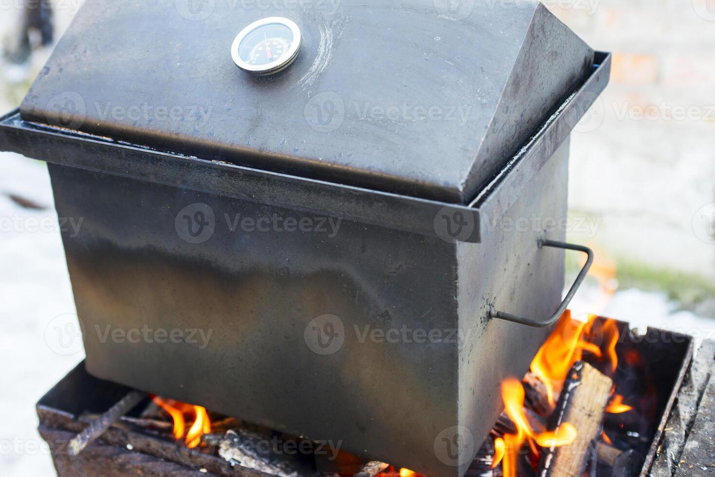 Outdoor Smoker on Fire Cooking Food photo