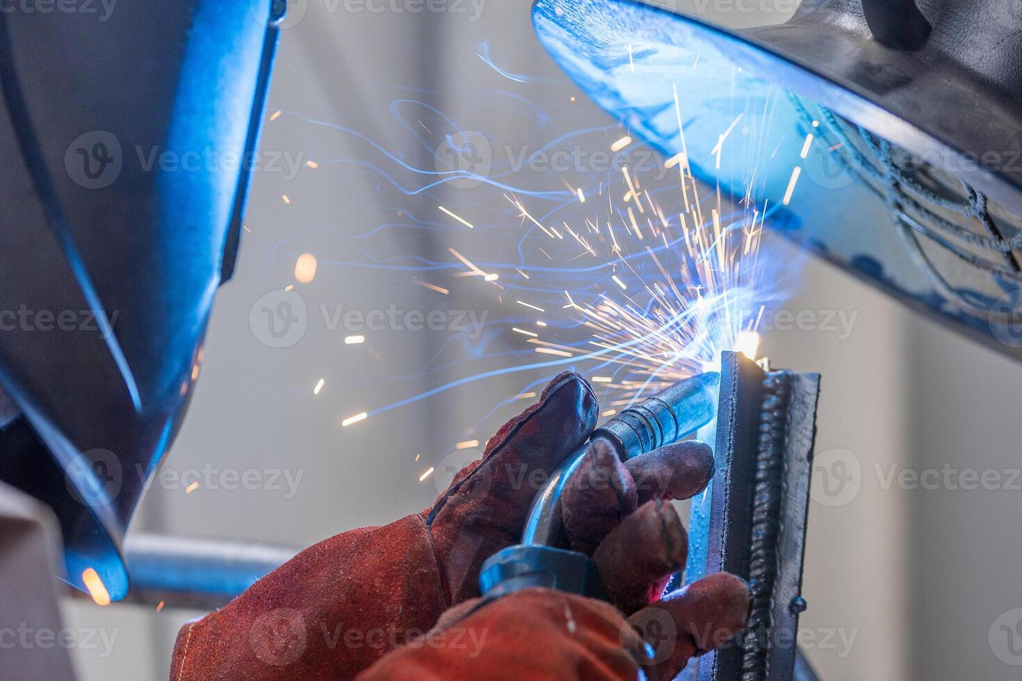Detail to welding process of metal parts, using a welding machine, bright sparks and flashes, industrial concept photo