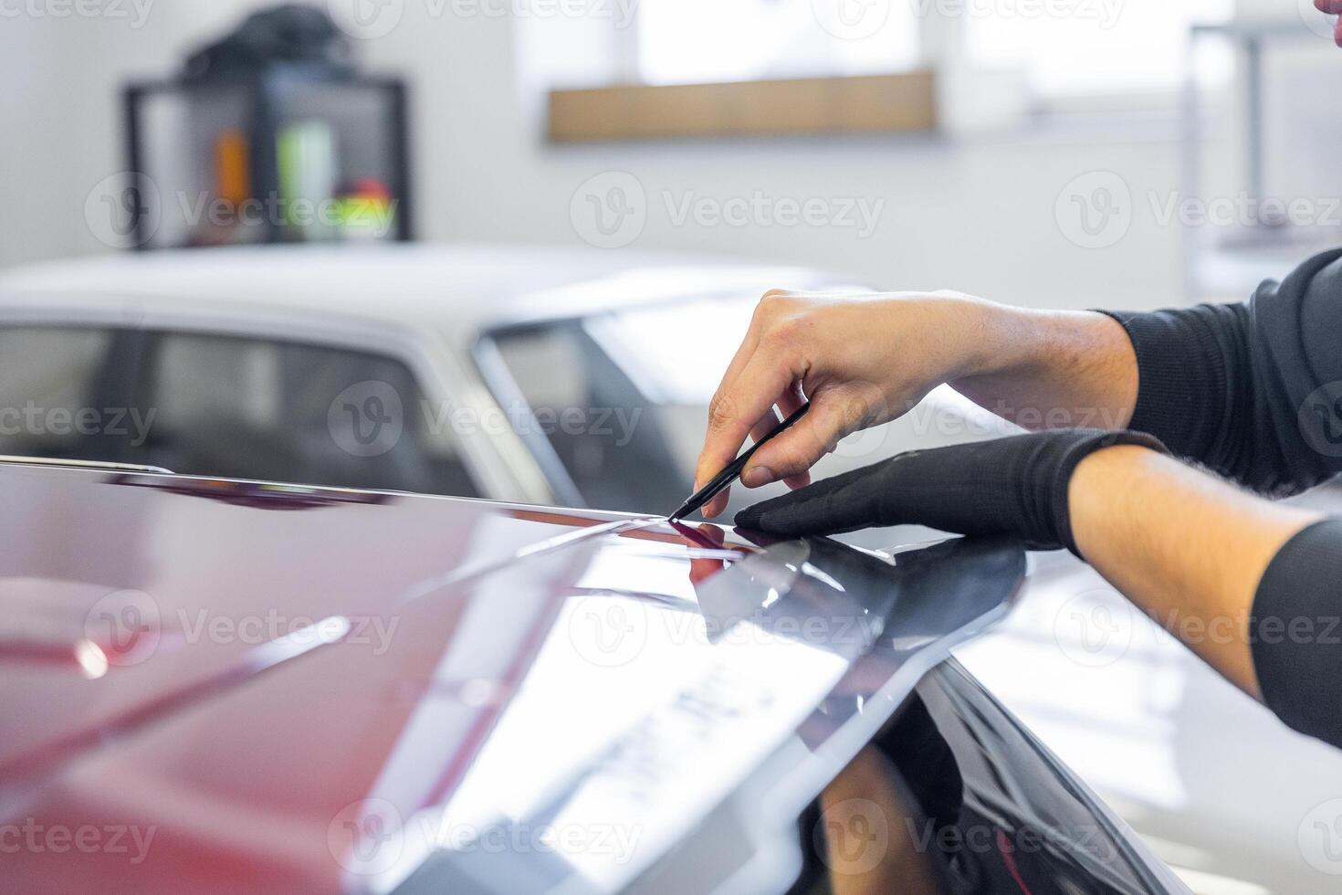 Process of gluing or wrapping a new foil wrap to a car, car detailing concept photo