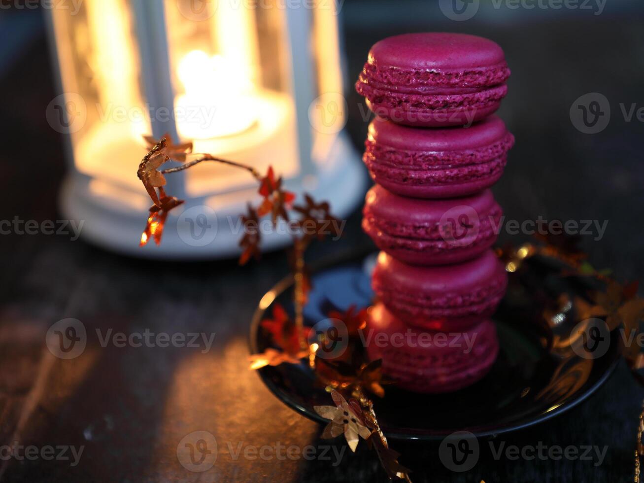 Macaroons and lantern moody food background. High quality photo