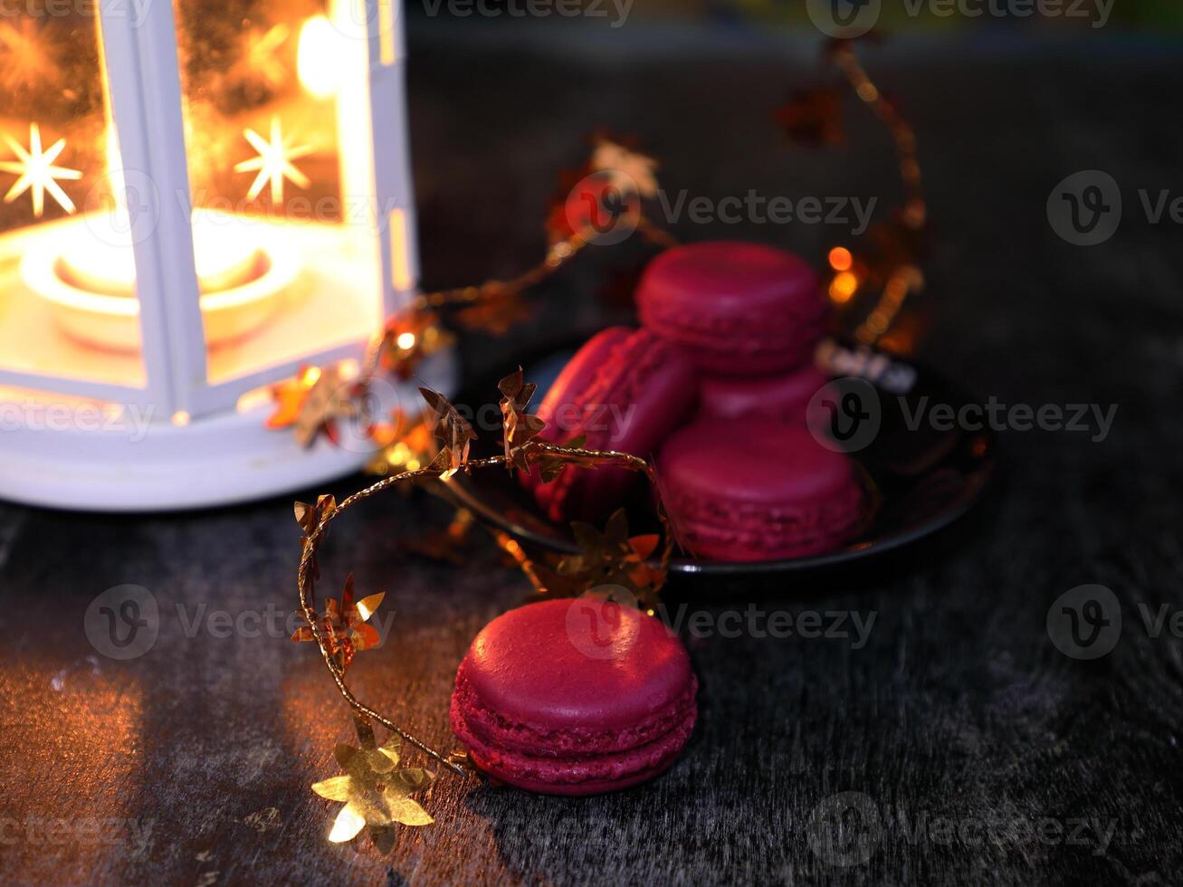Macaroons and lantern moody food background. High quality photo