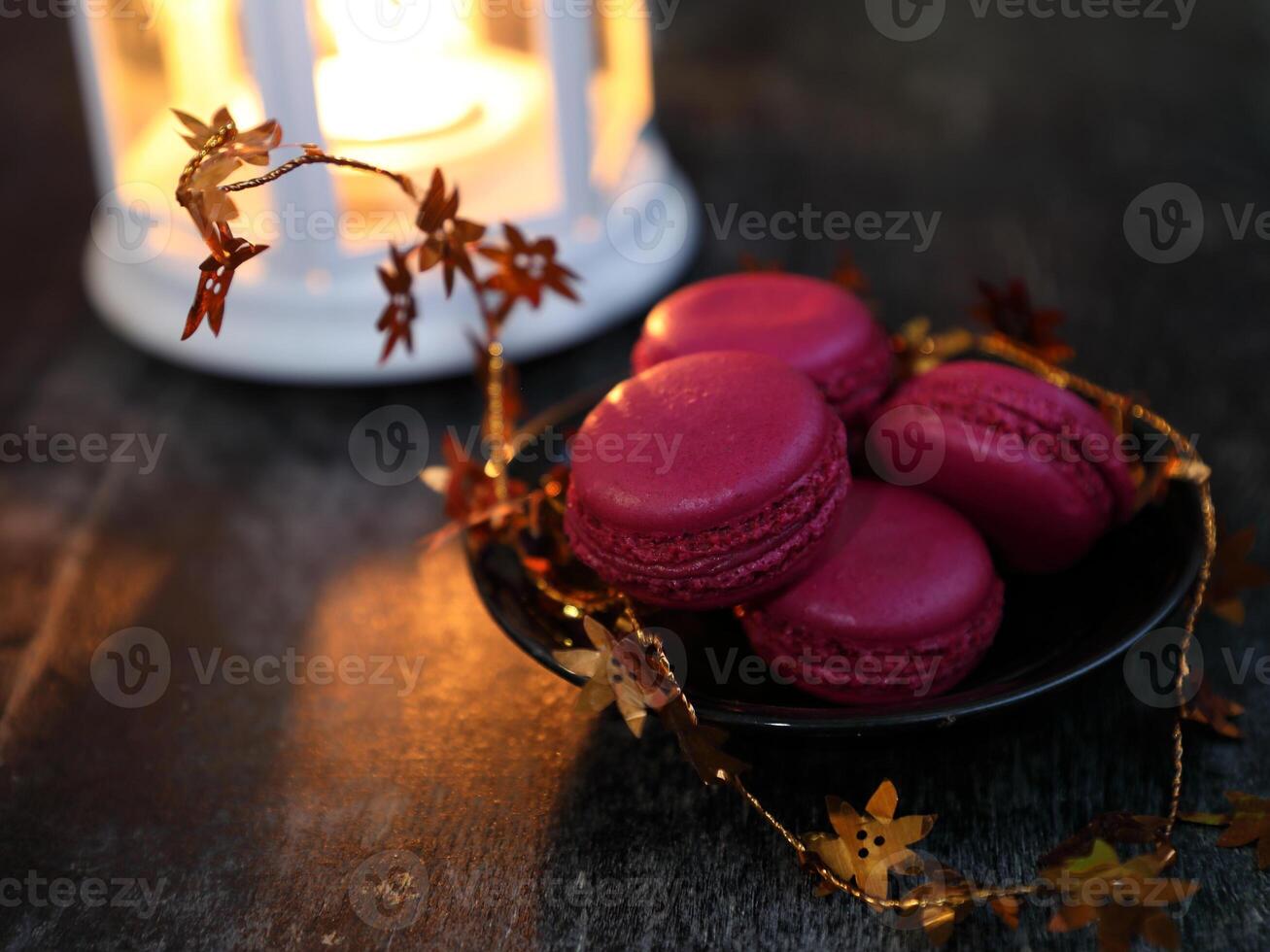Macaroons and lantern moody food background. High quality photo