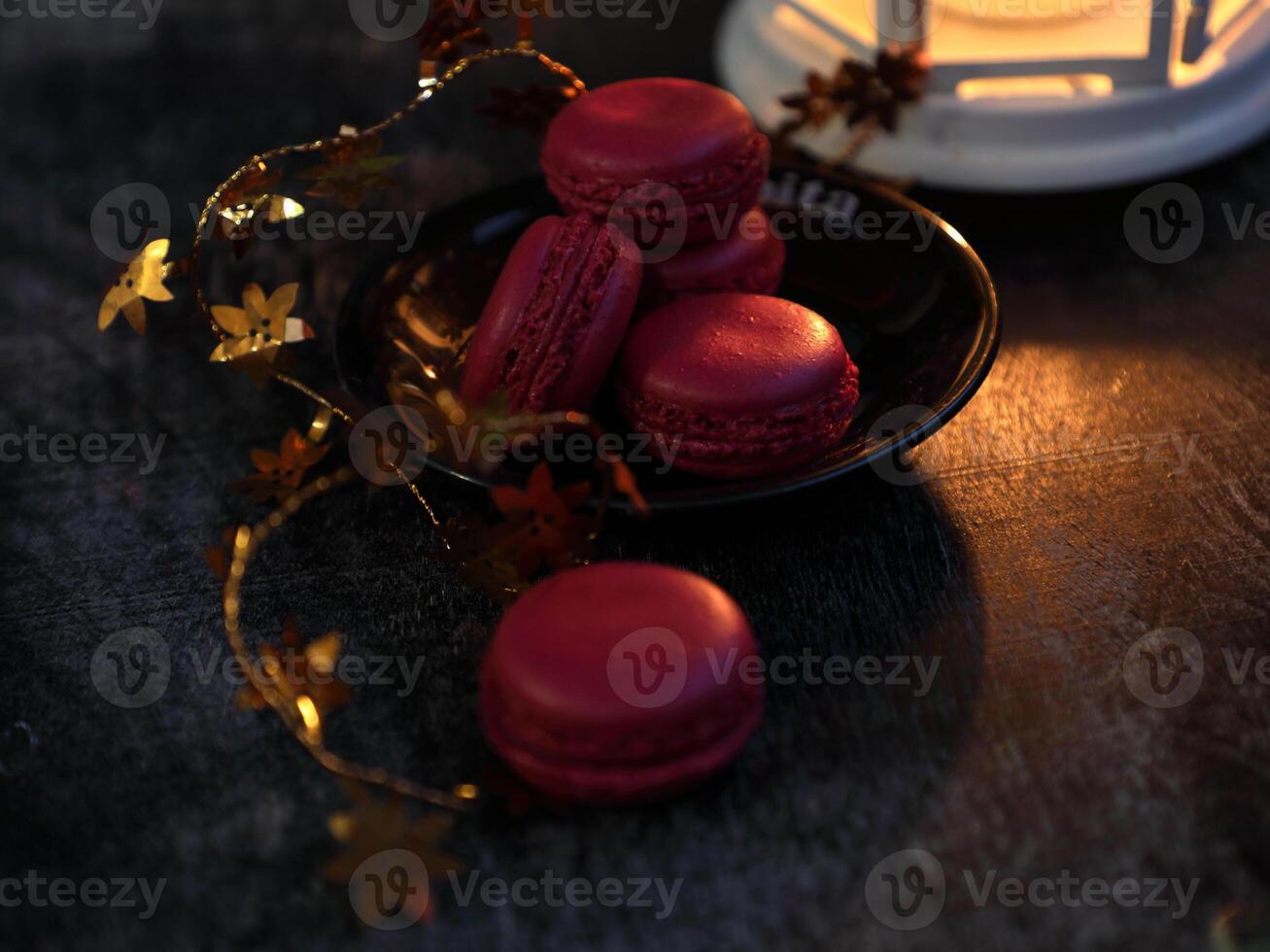 Macaroons and lantern moody food background. High quality photo