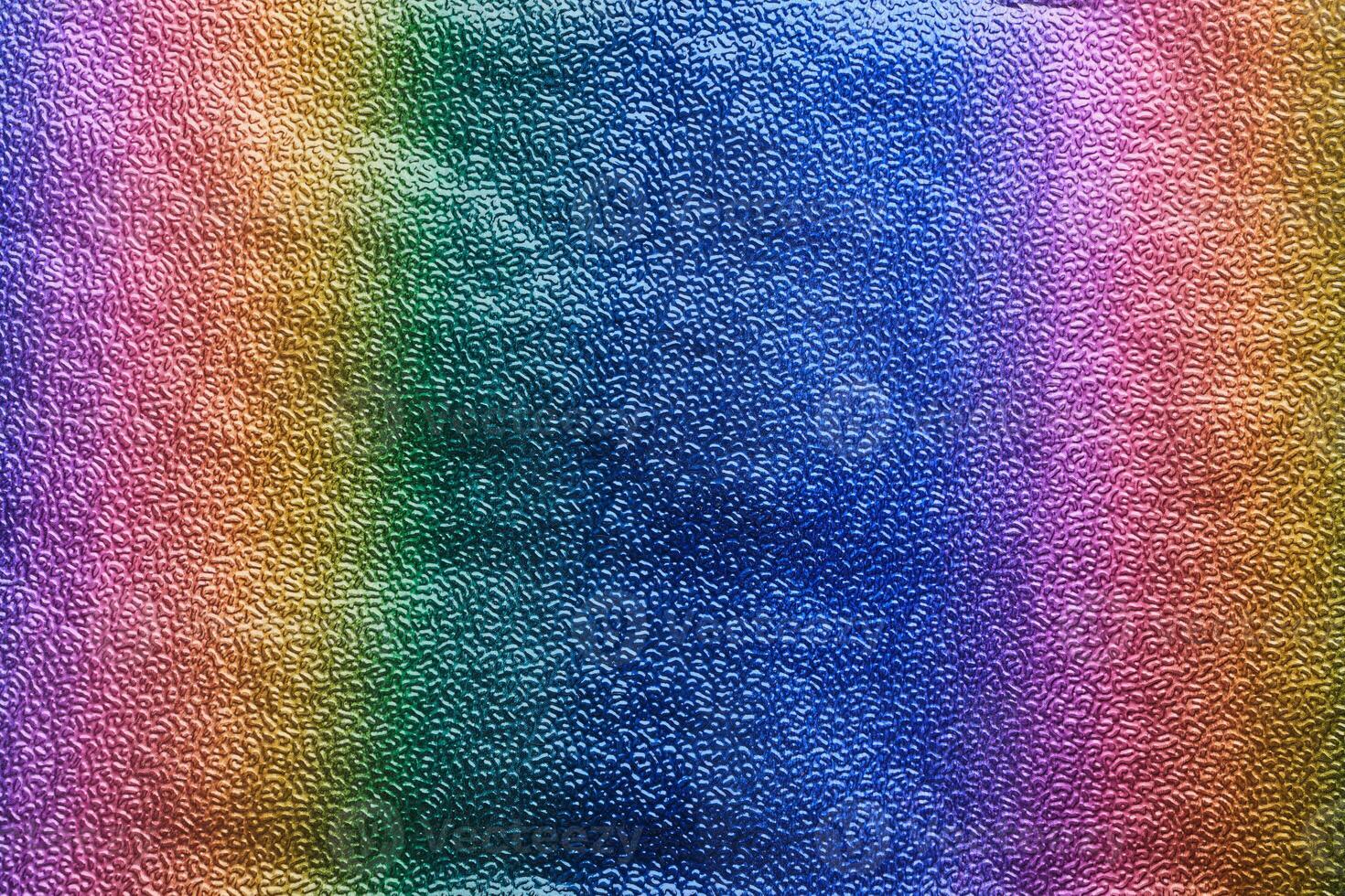 Rainbow gradient textural Background. Textured metallic paper or foil photo