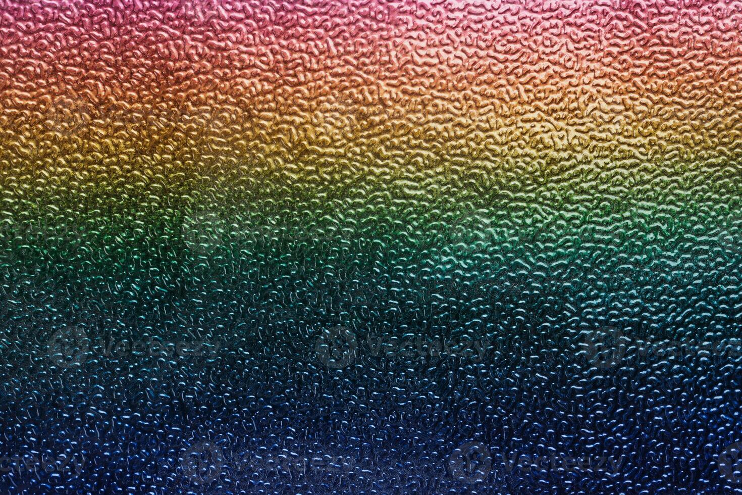 Rainbow gradient textural Background. Textured metallic paper or foil photo