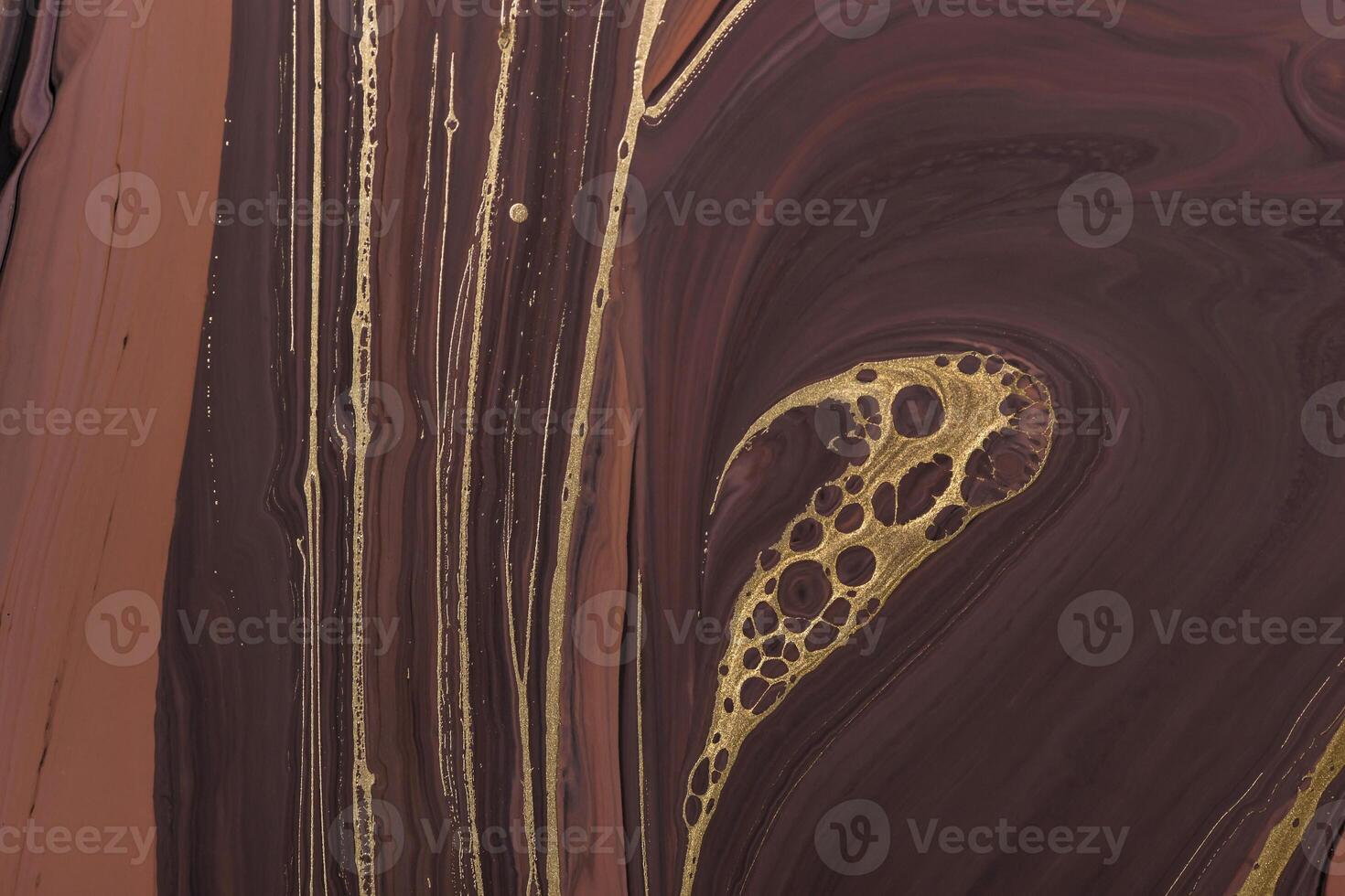 Abstract Golden curl and lines on brown waves. Acrylic Fluid Art. Art Deco marbling background or texture photo