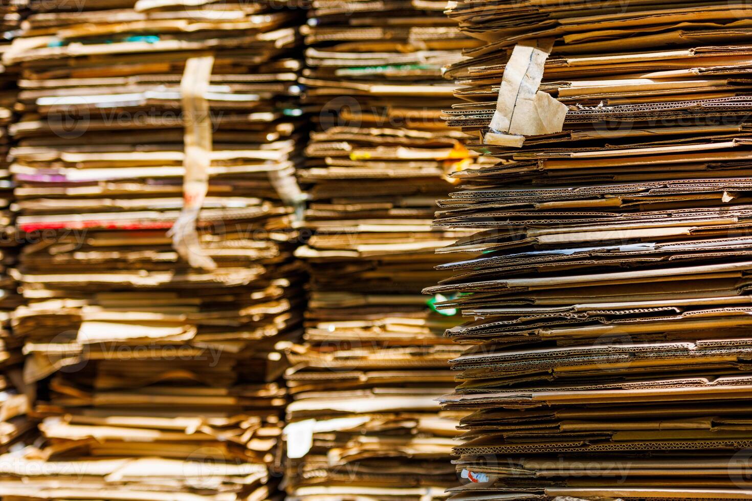 Stacks of crushed cardboard boxes, full-frame closeup background photo