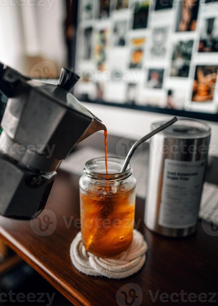 Make iced coffee from a moka pot and pour it into a glass. photo