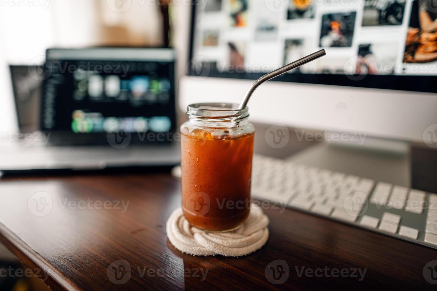 Iced coffee in a mug on the desk photo