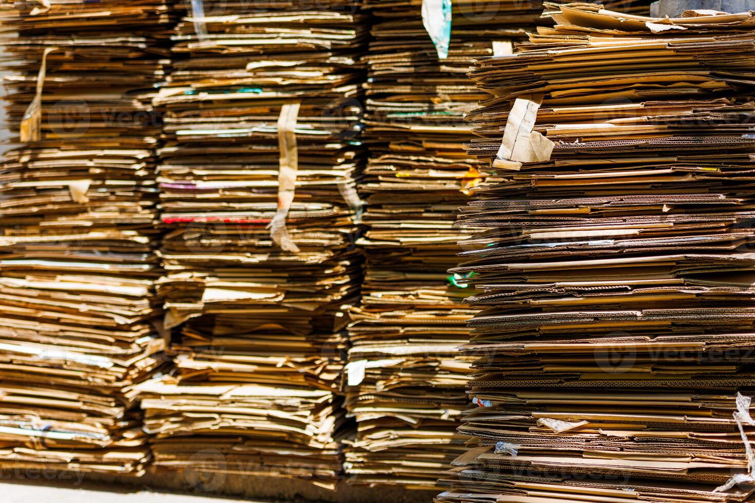 Stacks of crushed cardboard boxes, full-frame closeup background photo