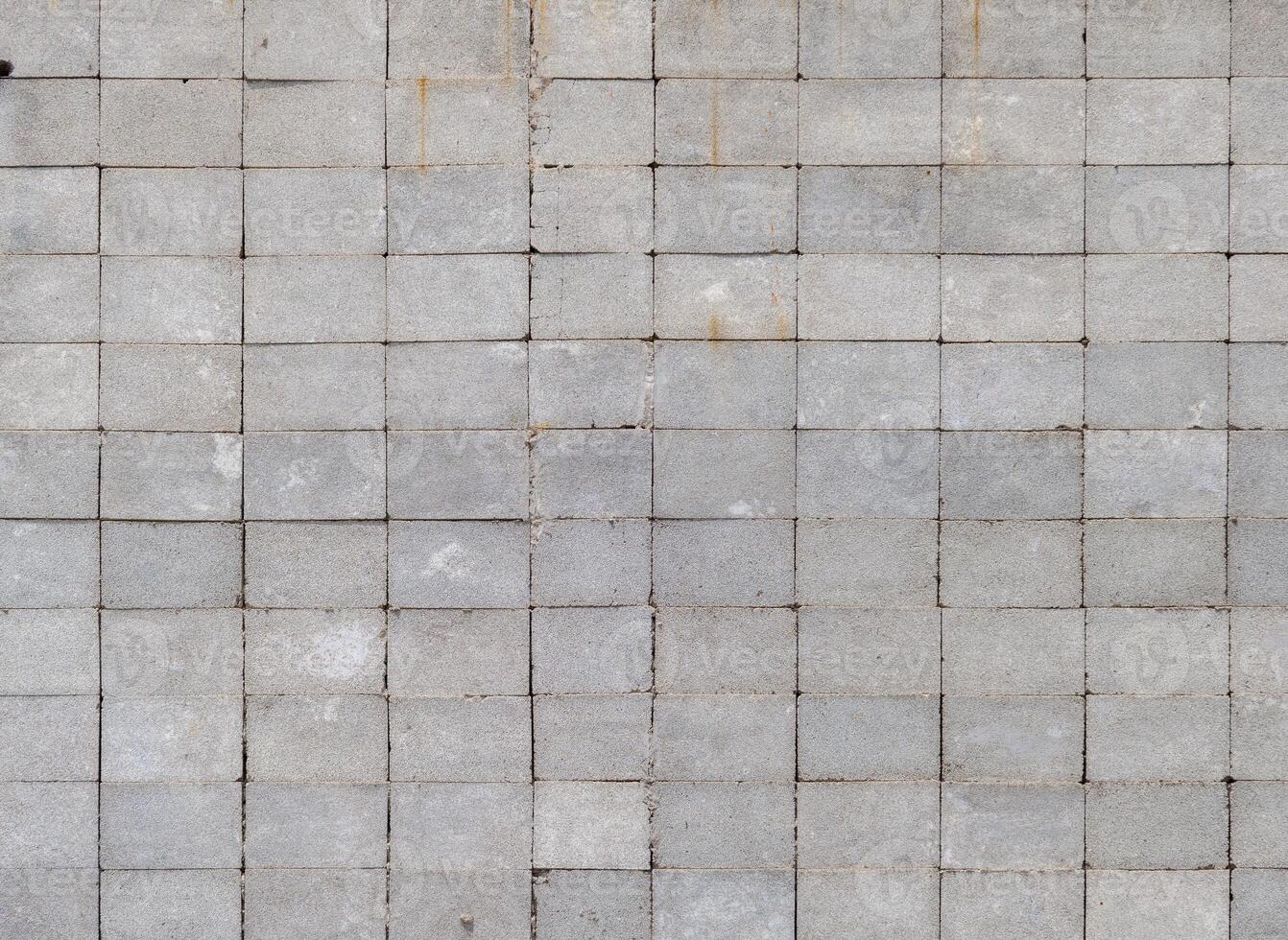 wall made of rectangular cinder blocks with stack bond pattern photo