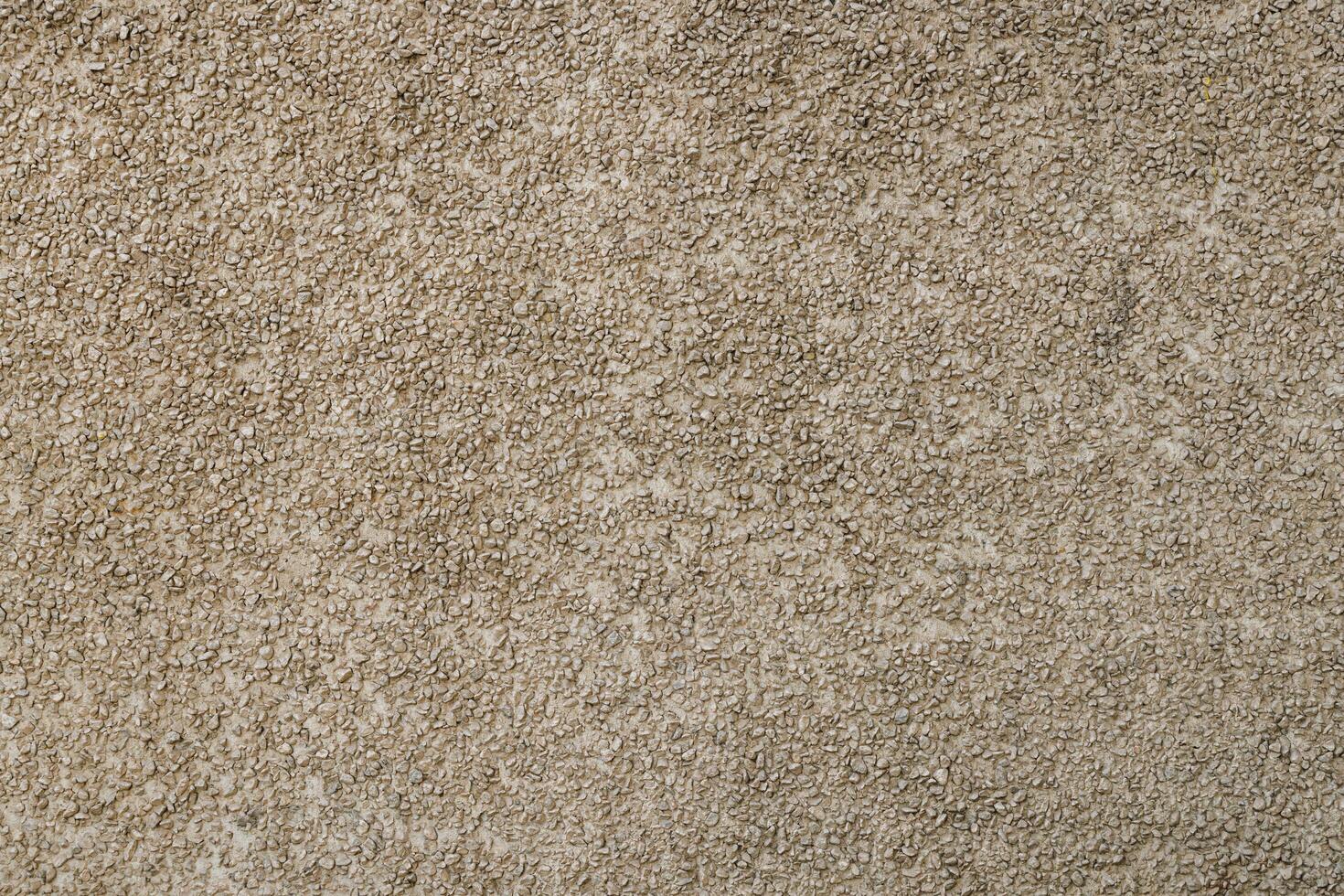 small gravel stucco wall finish texture and full-frame background photo