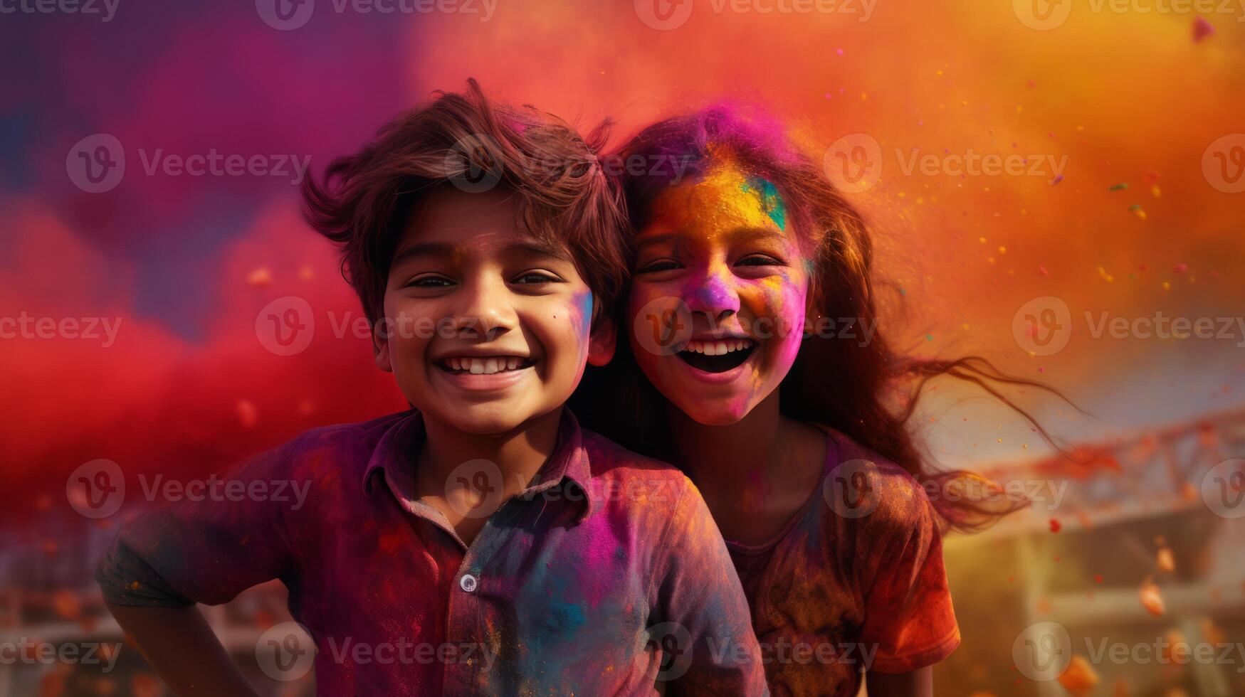 A boy and a girl with joyful faces at the celebration of the Holi festival. photo