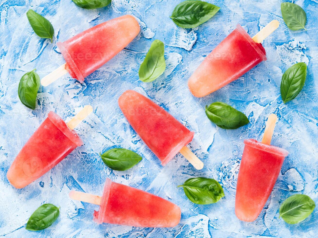 Top view of watermelon and basil popsicles photo