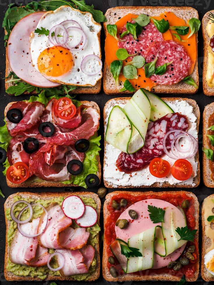 open sandwiches with different meat, top view photo