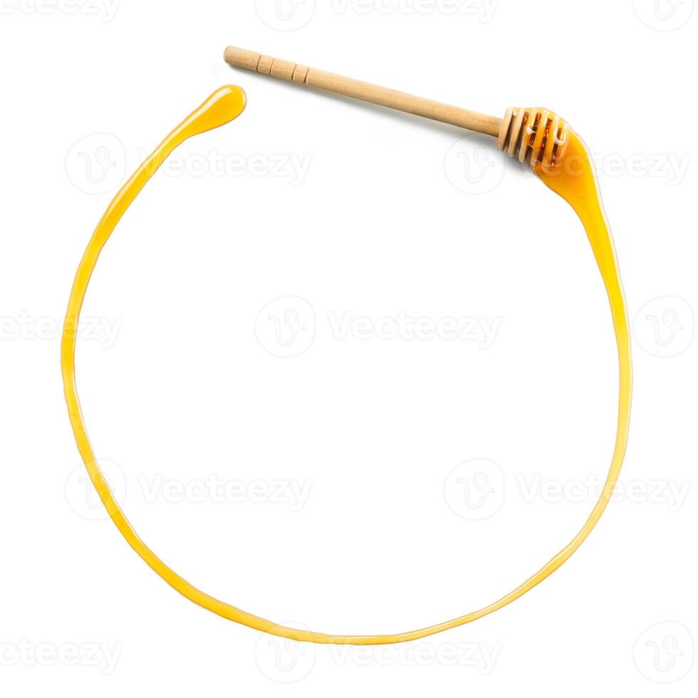 honey dipper with honey in circle form, copyspace photo