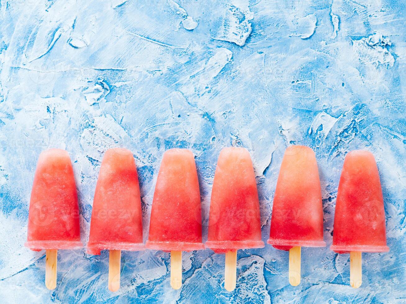 Top view of watermelon popsicles with copy space photo