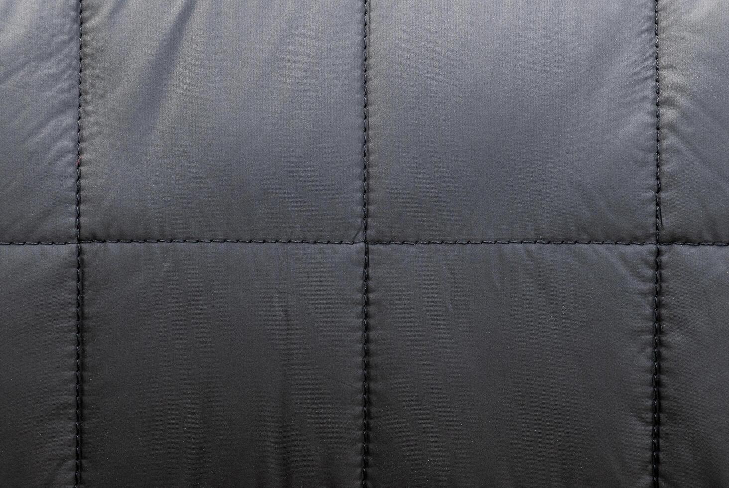 Texture black leather sofa has square seams. photo