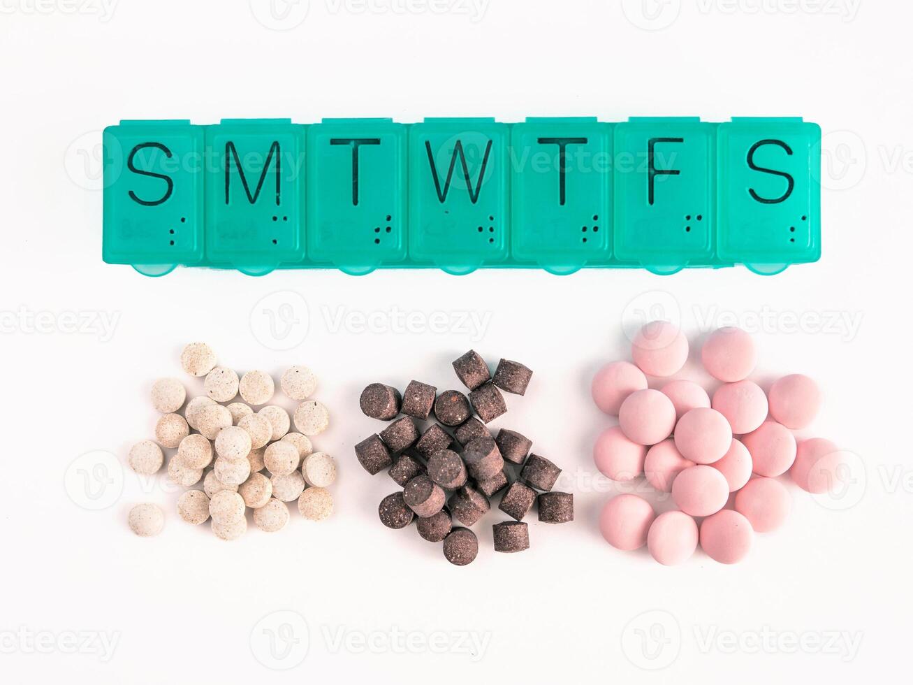 top view of pill box and pills isolated on white photo