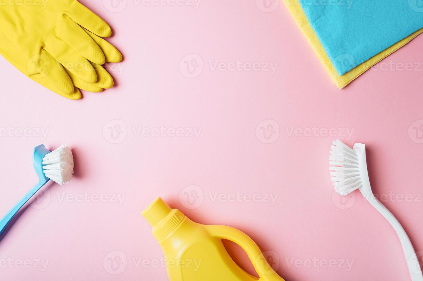 House cleaning product on pink background, copy space photo