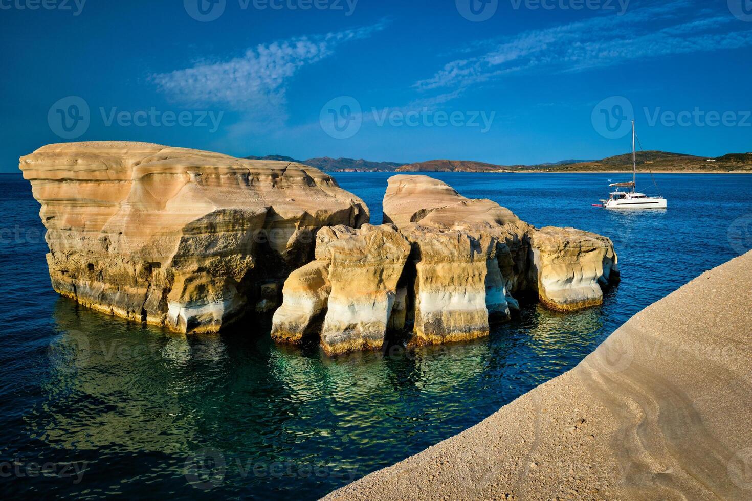 Yacht boat at Sarakiniko Beach in Aegean sea, Milos island , Greece photo