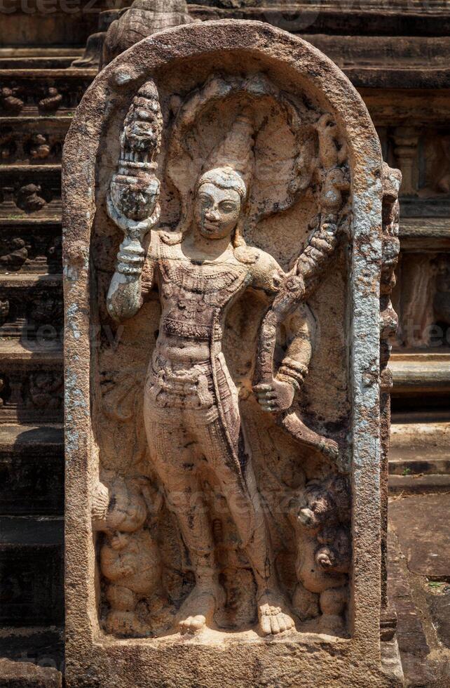 Ancient guardstone relief photo