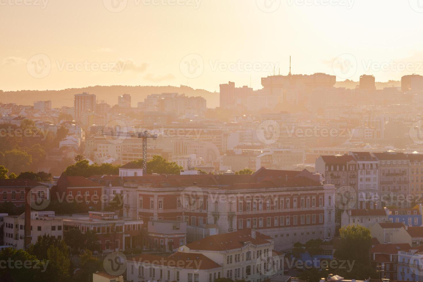 Sunset contre-jour view of Lisbon from Miradouro da Senhora do Monte viewpoint. Lisbon, Portugal photo