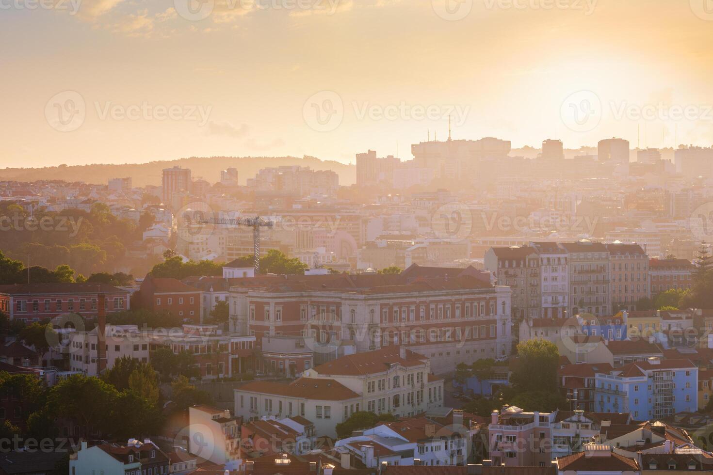 Sunset contre-jour view of Lisbon from Miradouro da Senhora do Monte viewpoint. Lisbon, Portugal photo