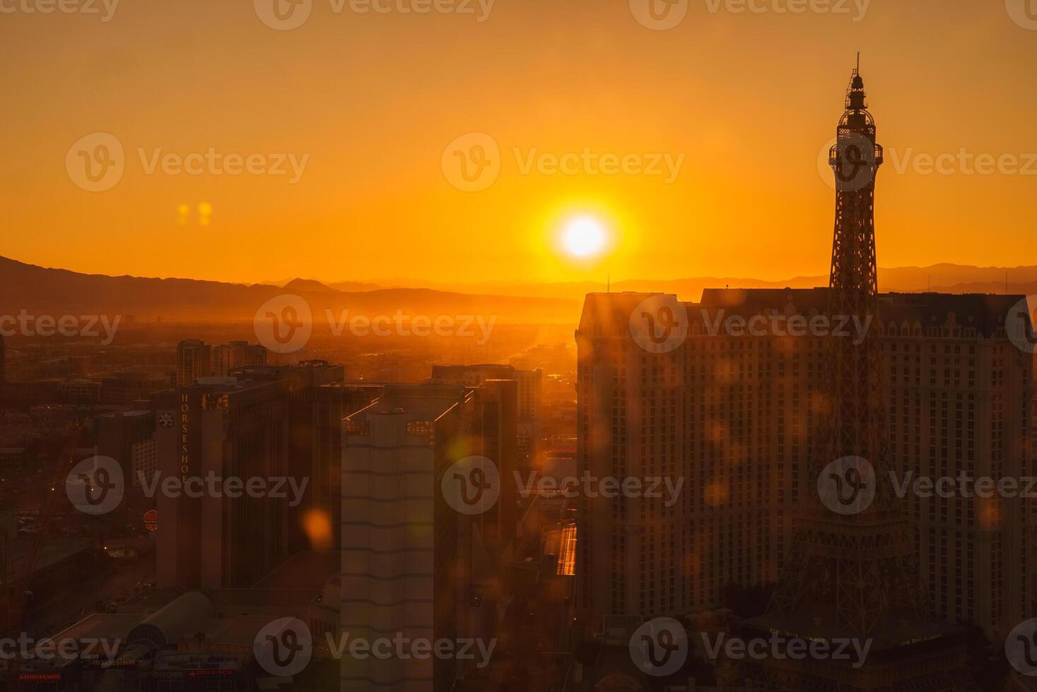 Las Vegas Strip skyline at sunset, cityscape with Eiffel Tower silhouette photo