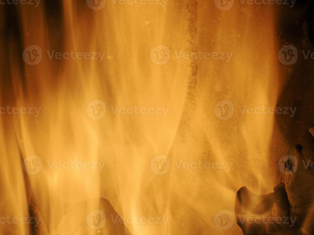 flames burning wood inside the fireplace photo