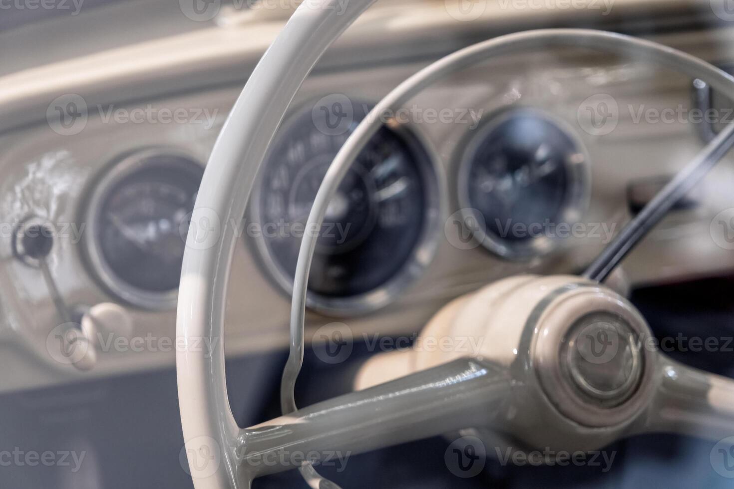 Steering wheel and dashboard of old car photo