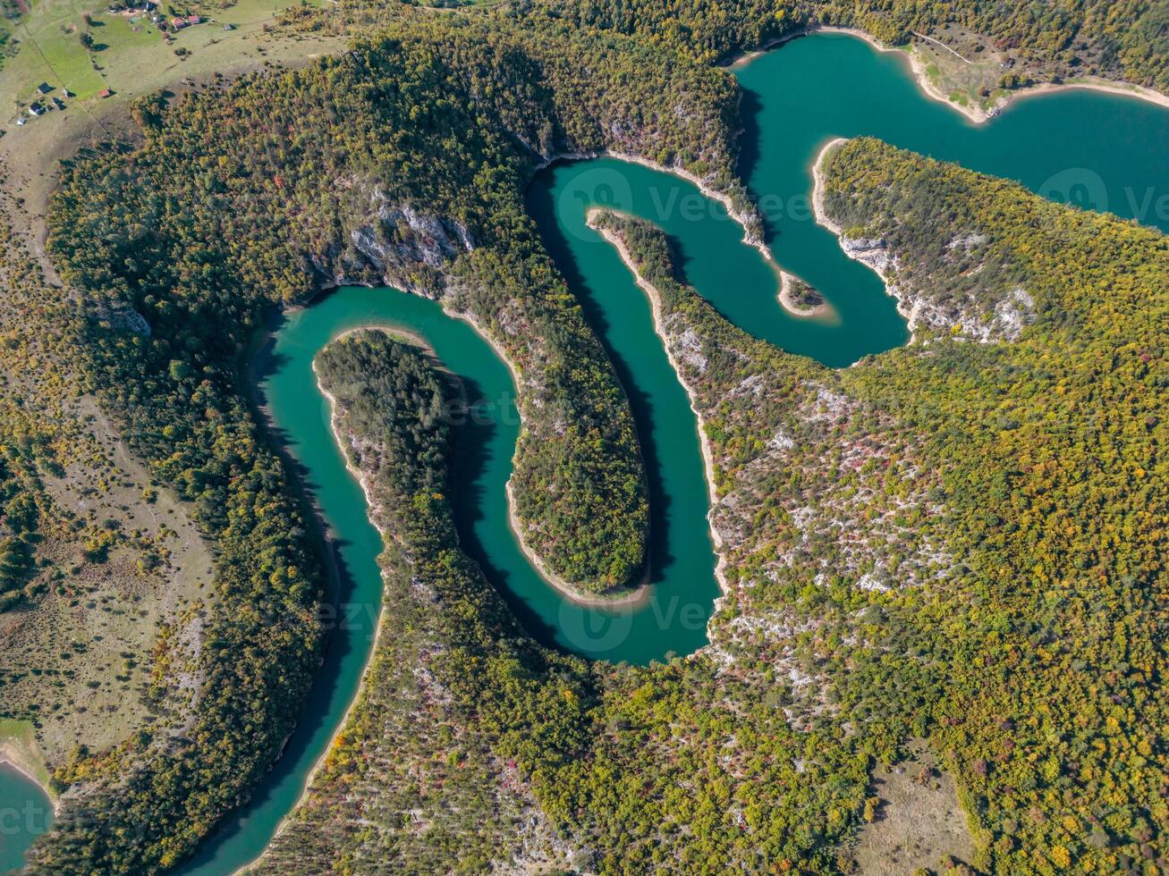 Top view on meanders at rocky river photo