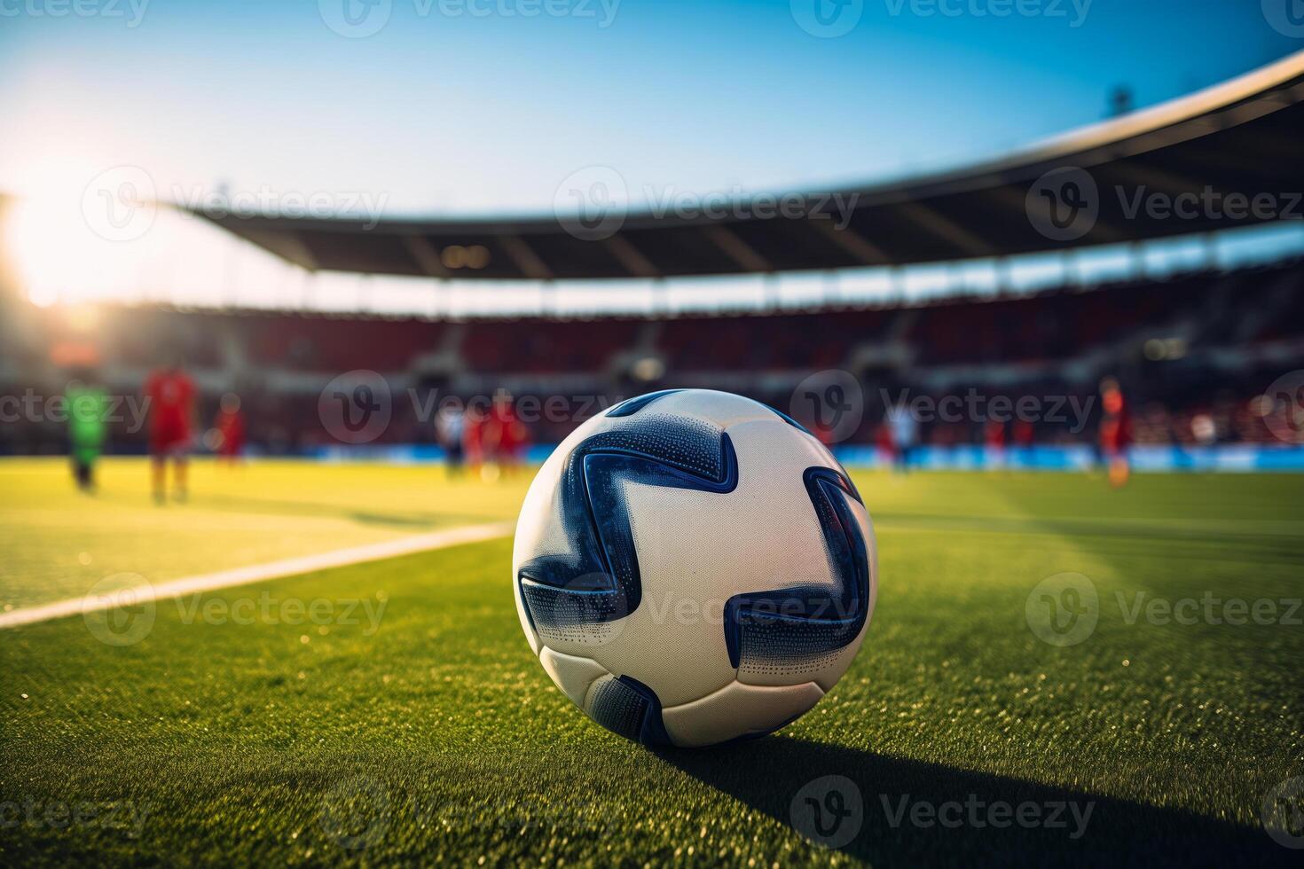 A soccer ball on a green field in soccer football stadium during game photo