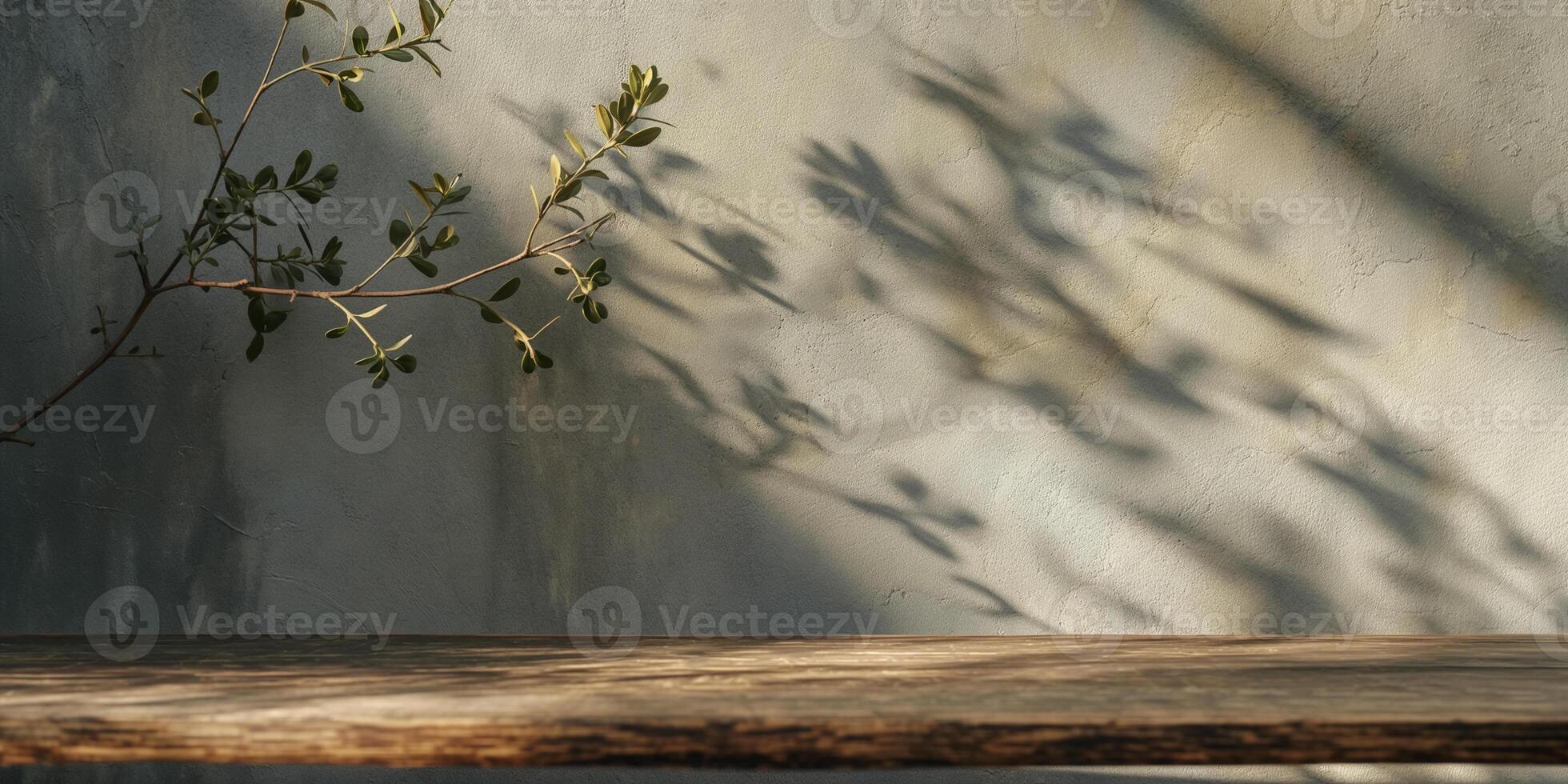 Mockup for product display. Wooden table and shadow from plant branch on grey concrete wall. Sunny modern interior background. photo