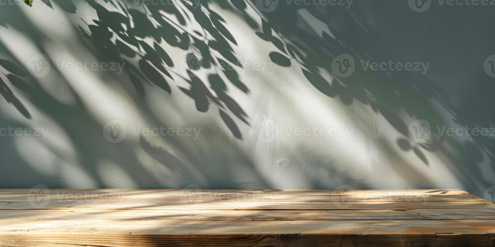 Mockup for product display. Sunny modern interior background, copy space. Wooden table and shadow from plant branch on grey concrete wall. photo