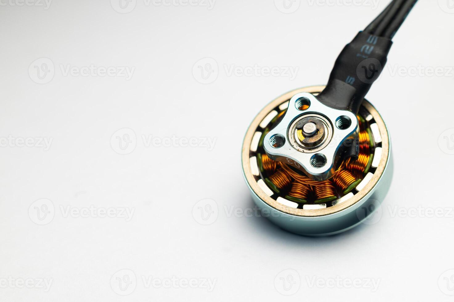 Close-up Small brushless electric motor for drone. Extreme macro photography. photo