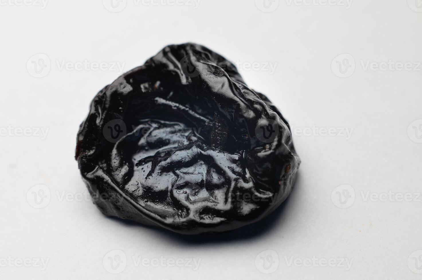 Dried plum, prunes on white background. Clipping Path. Shallow depth of field photo