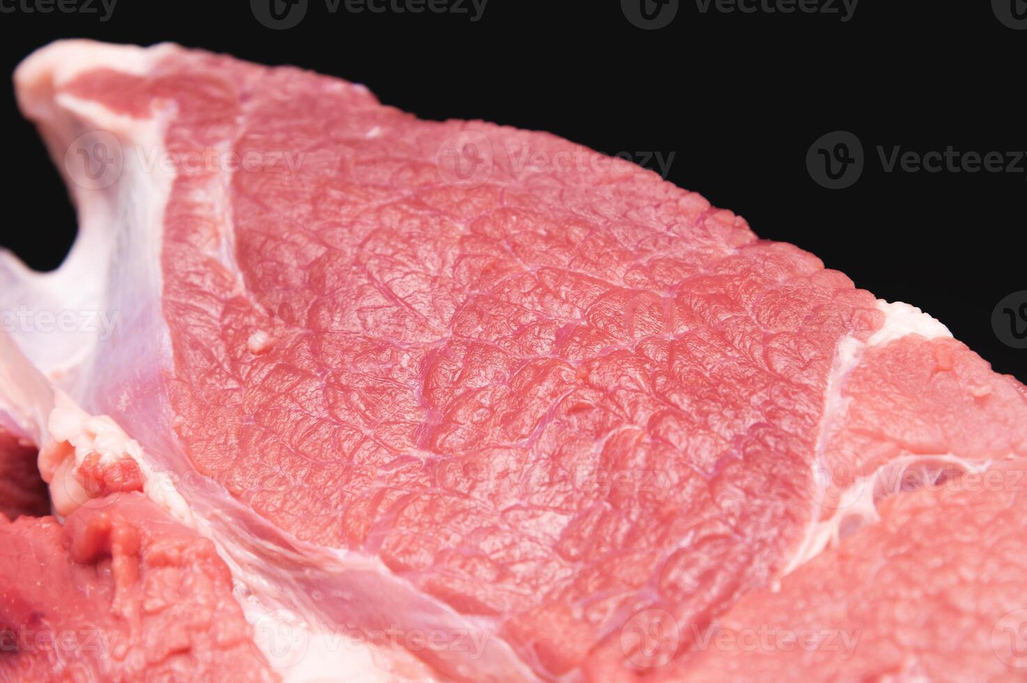 Raw large premium steak. Raw fresh premium beef in shallow depth of field photo