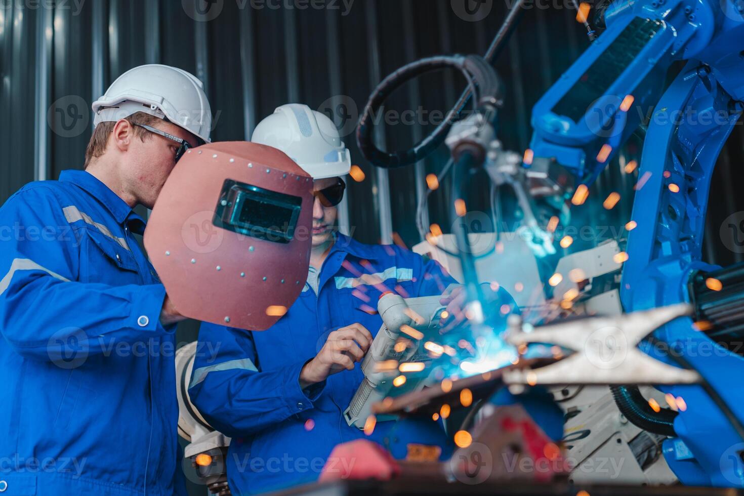 Teamwork of male engineers checking and maintaining the quality of the robot arm, robot arm factory Technology and engineering concepts. photo