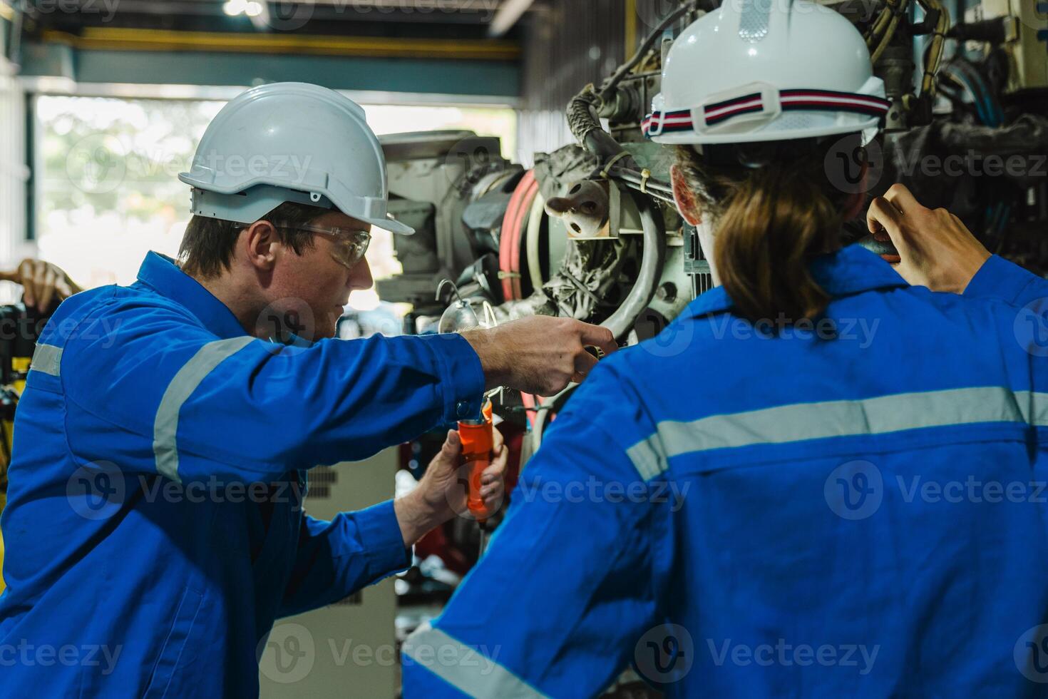 Teamwork of male engineers checking and maintaining the quality of the robot arm, robot arm factory Technology and engineering concepts. photo