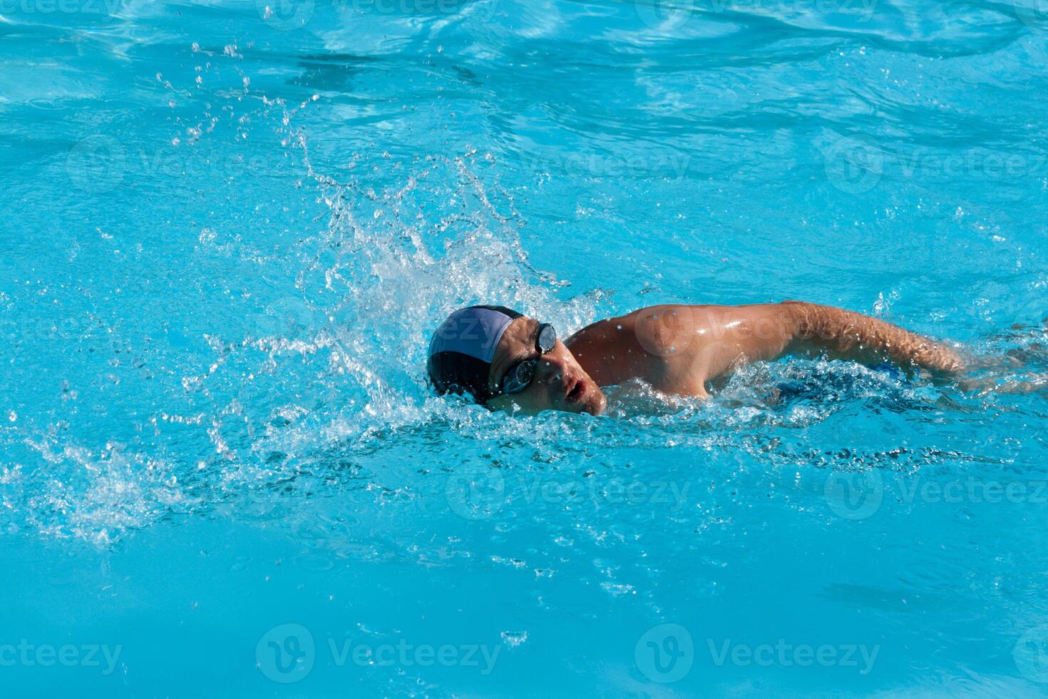 Swimming man in pool photo