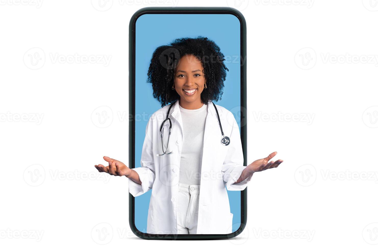 Happy black millennial lady doctor in white coat hold copy space on hands on big phone screen, isolated on blue studio background. Professional occupation, choice, medicine and health care app photo