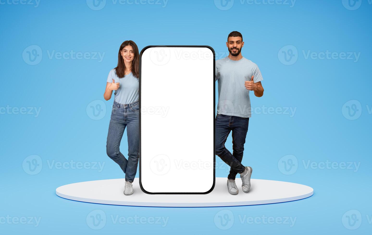 Mobile Mockup. Happy Arabic Couple Standing Near Huge Blank Smartphone And Showing Thumbs Up, Smiling Middle Eastern Man And Woman Recommending New App Or Website On Blue Background, Collage, Mockup photo