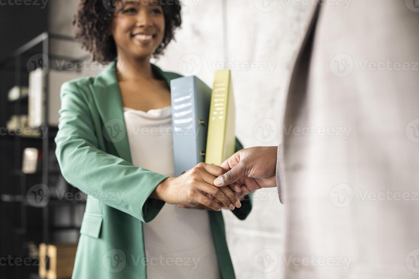 Business Partnership And Employment. African American Businesswoman And Businessman Shaking Hands Standing In Modern Office. Recruitment Of New Employee. Cropped, Selective Focus photo