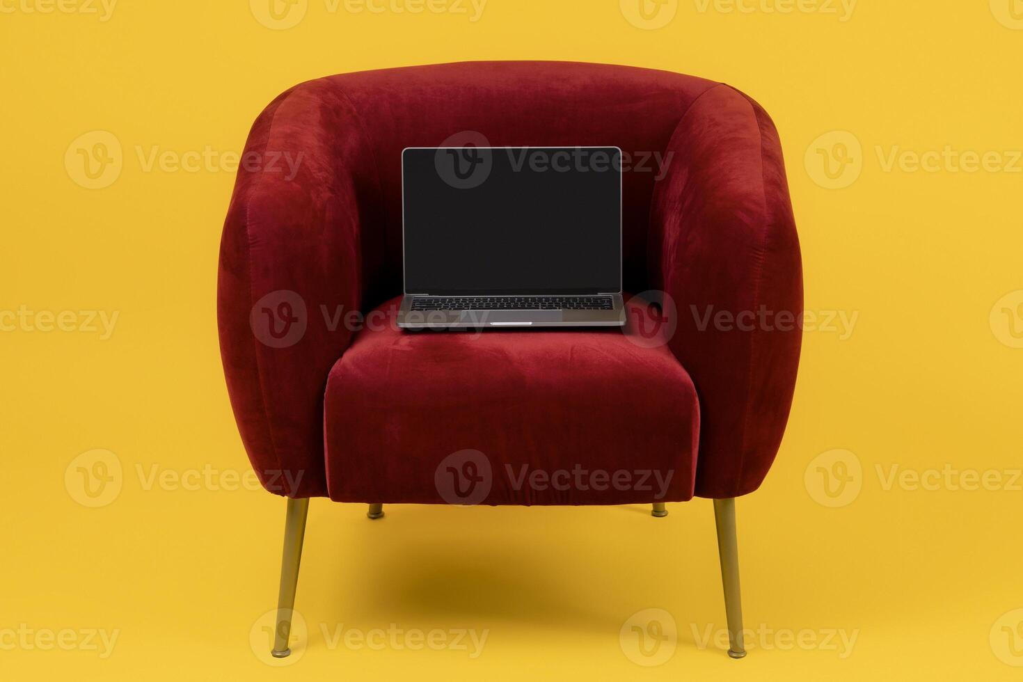 Laptop Computer With Empty Screen, Mockup For Online Website Advertisement, Standing On Red Armchair Over Yellow Background, Studio Shot Of Portable PC. Freelance And Internet Technology photo