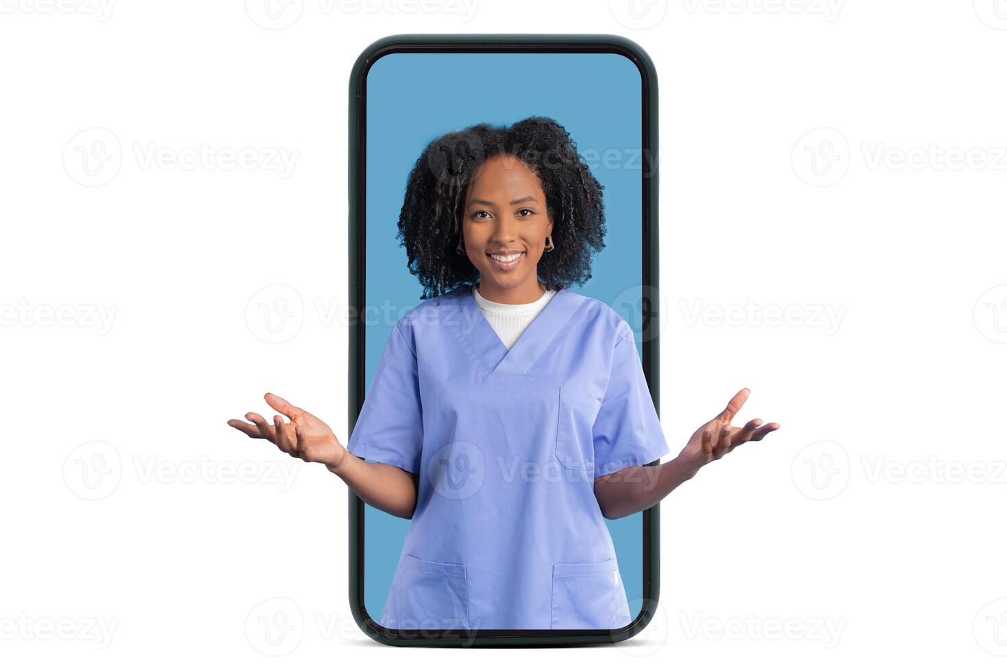 Cheerful young black woman doctor nurse in blue uniform hold empty space on hands on big smartphone screen, isolated on white studio background. Technology, medicine, app health care photo