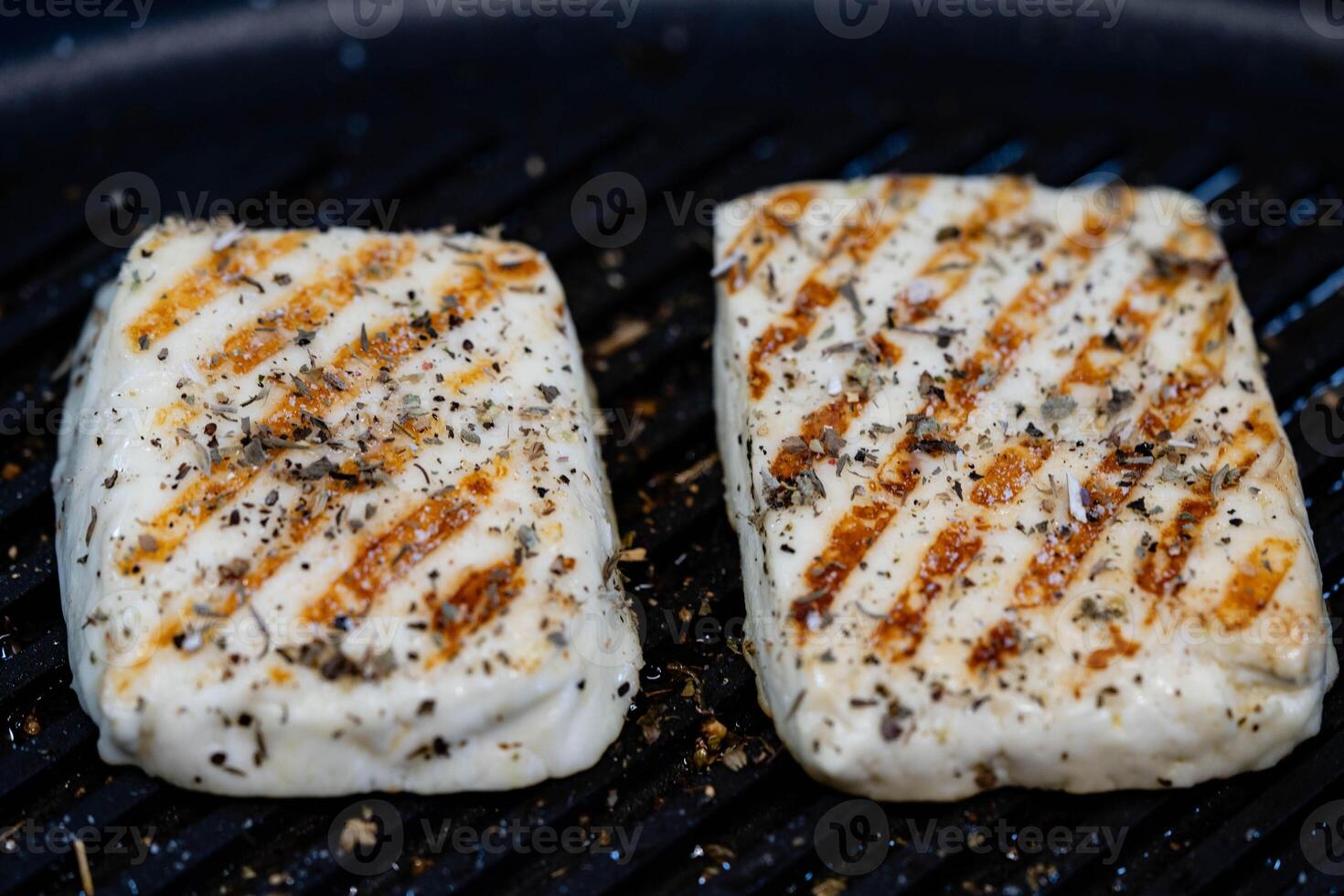 breaded and baked greek sheep's cheese with herbs and spices photo
