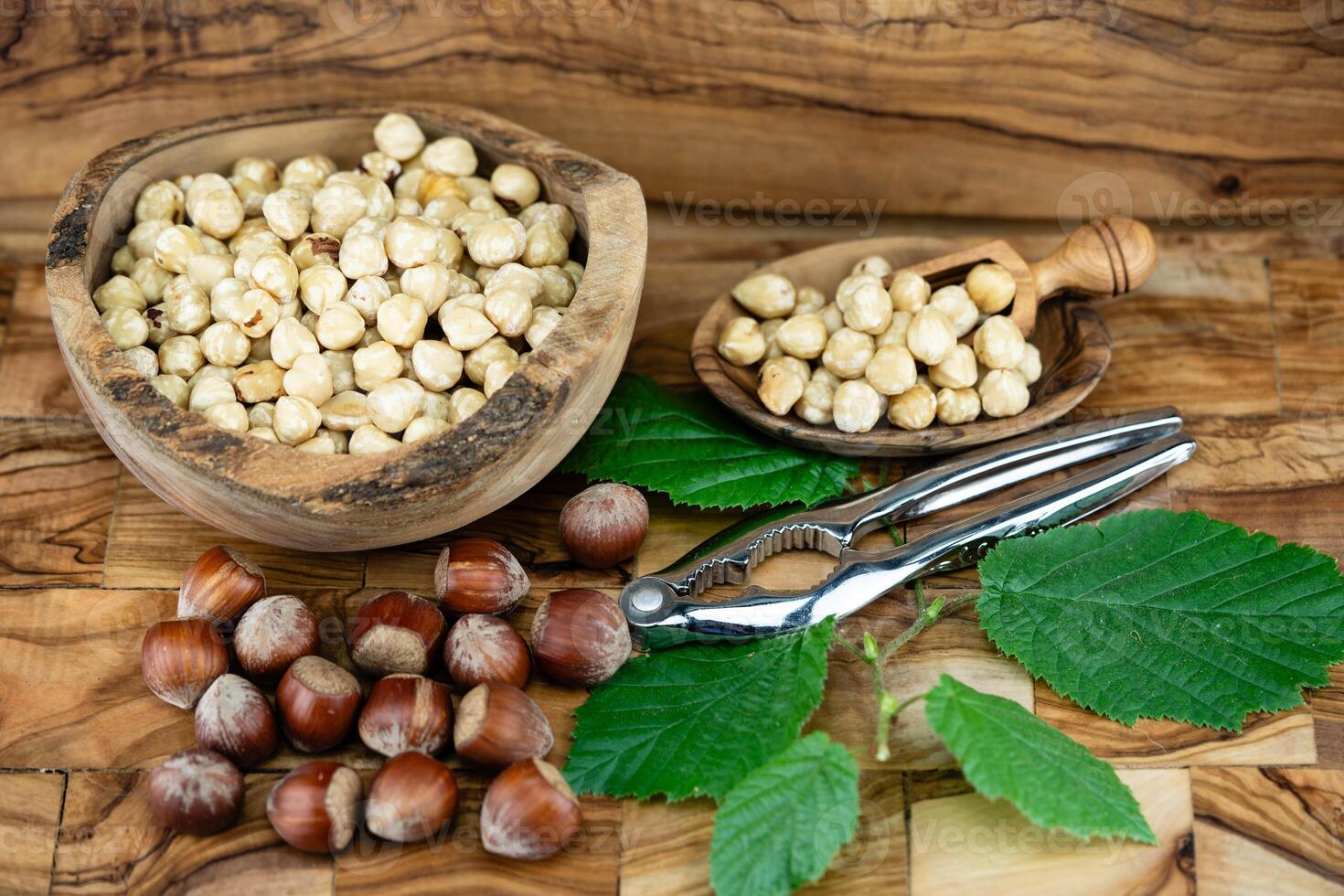 Hazelnut fruits Corylus avellana on olive wood photo