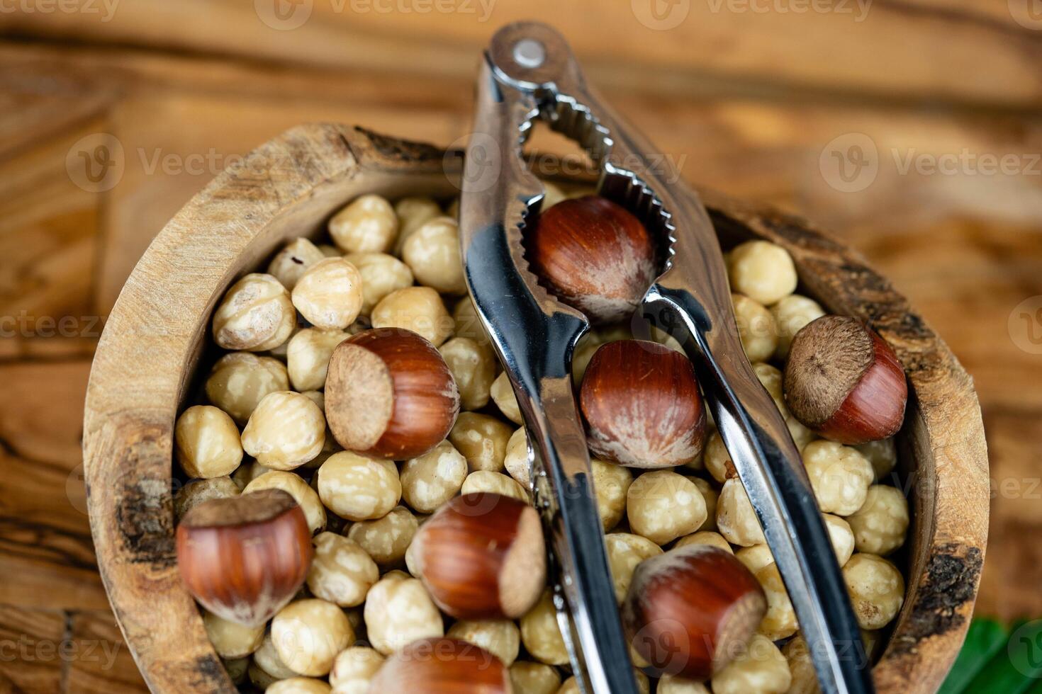 Hazelnut fruits Corylus avellana on olive wood photo