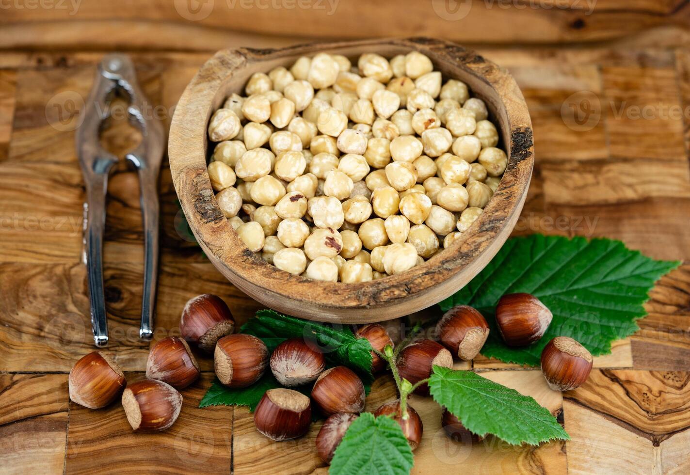 Hazelnut fruits Corylus avellana on olive wood photo